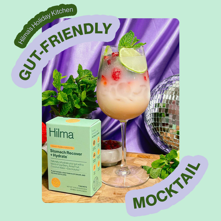 Hilma's Holiday Kitchen: Gut Friendly Mocktail, Hilma Stomach Reset and wine glass with mocktail garnished with lime and mint
