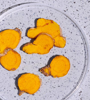Turmeric on a purple speckled background