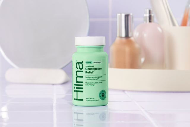 Bathroom setting with hilma constipation reliefon a tiled shelf