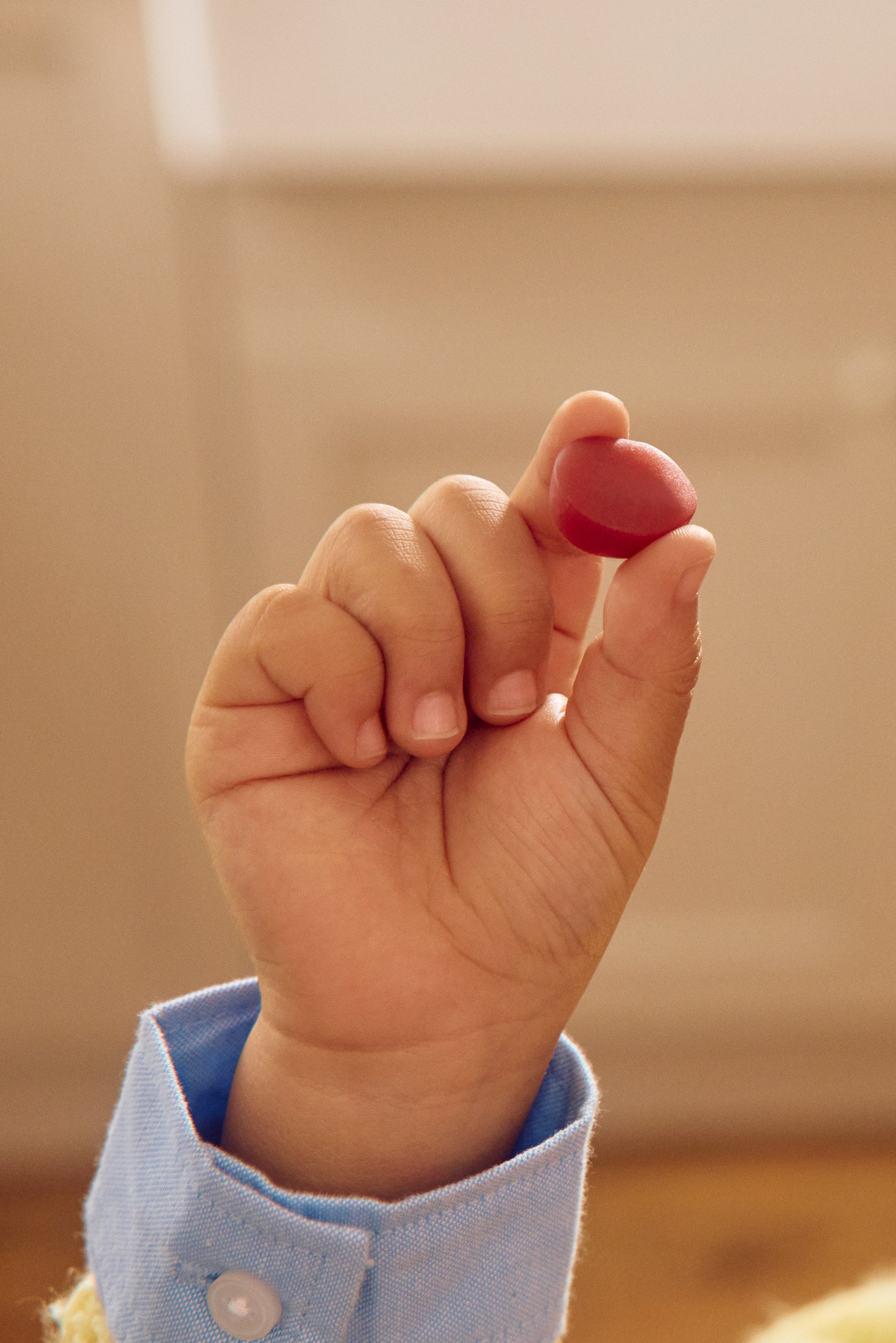 Hand holding a gummy
