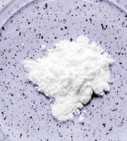 White powder (dairy-digesting enzymes) on a purple speckled background